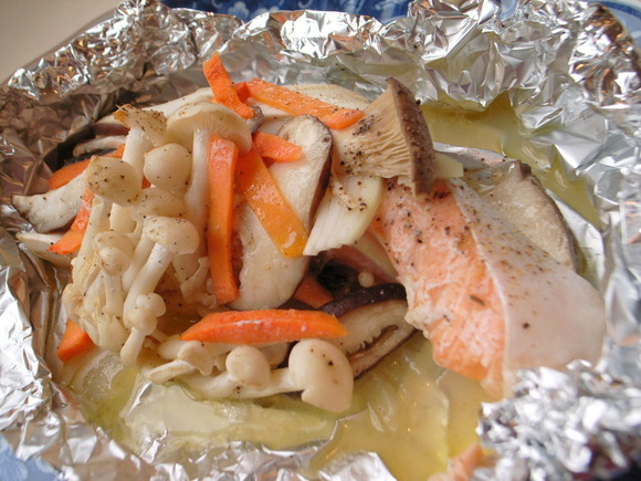 Salmon and mushrooms baked in foil with butter