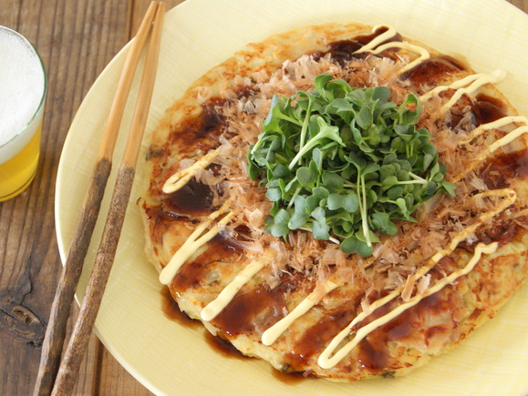 Fluffy okonomi-yaki pancakes with fresh, crisp radish sprouts and cabbage